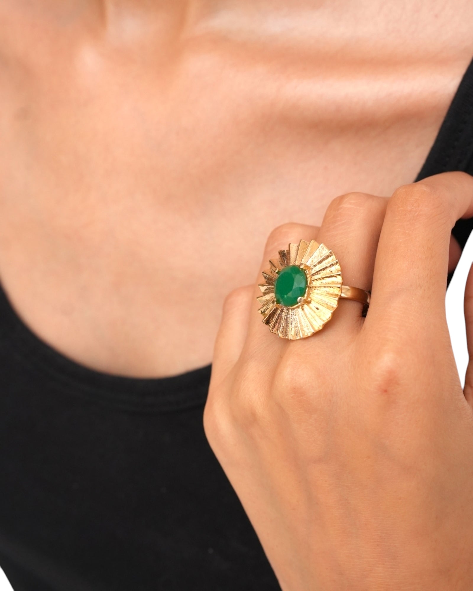 Close-up of Verde Ring featuring fan-inspired design and green gemstone

