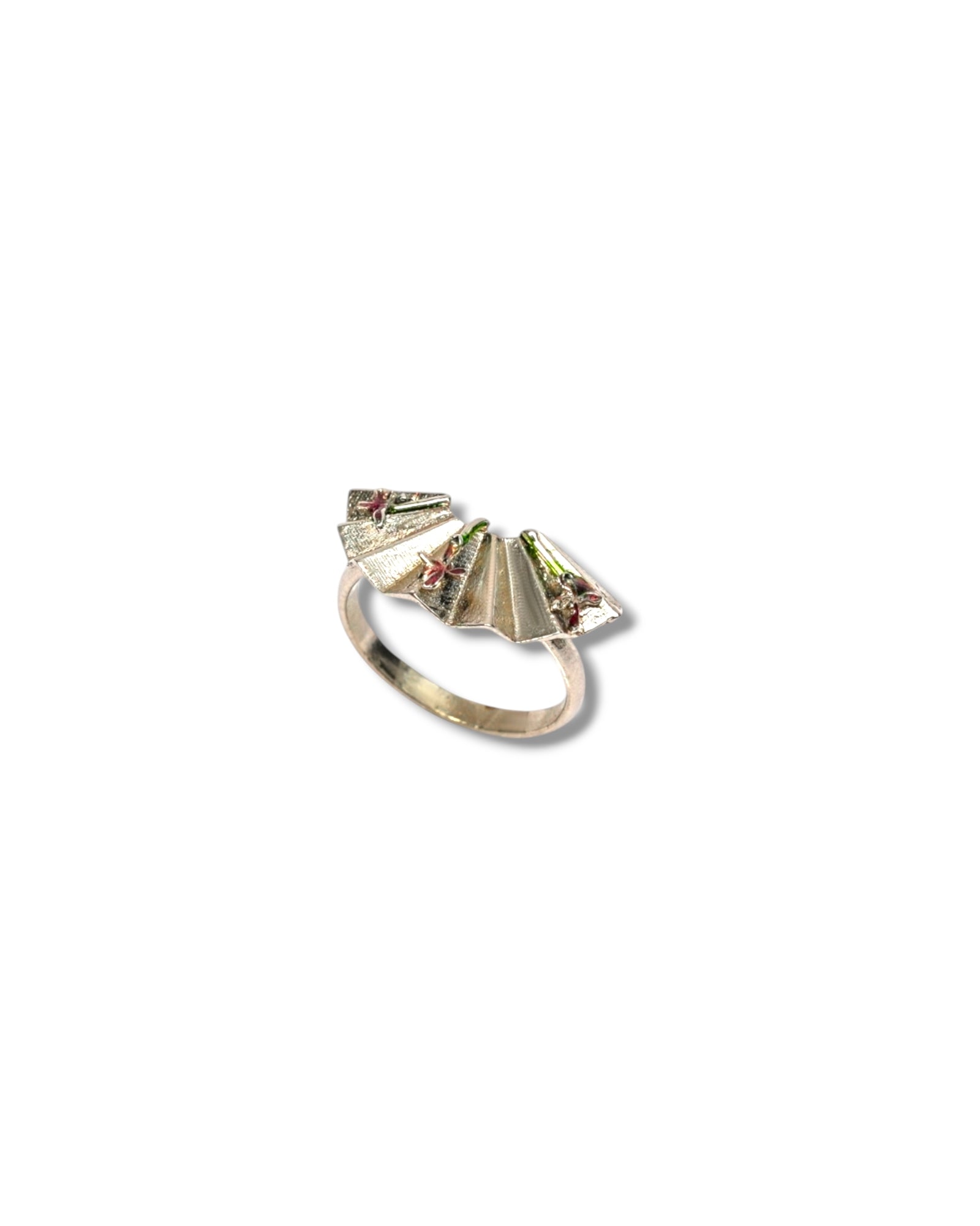 Close-up of Rossi Ring showing fan-inspired folds and enamel detailing

