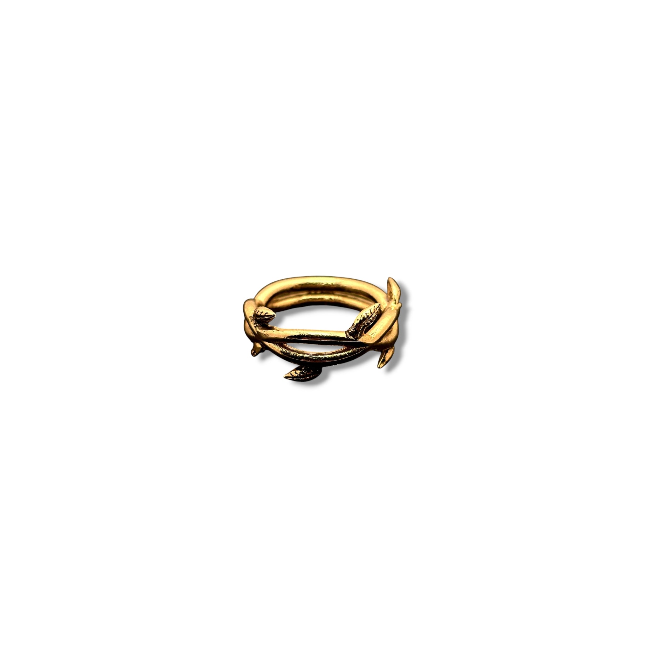 Gold-plated Celestia Ring from SU Jewelry, showcasing intricate vine and leaf design influenced by Lily of the Valley bloom
