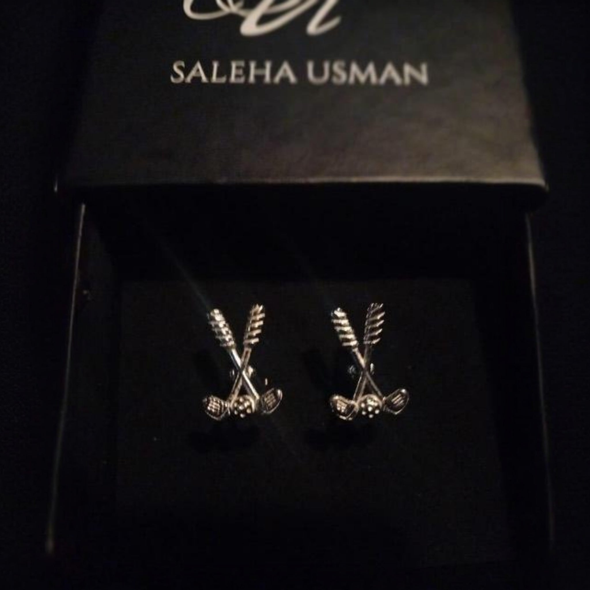 Close-up of Elite Swing Cufflinks with sleek silver finish

