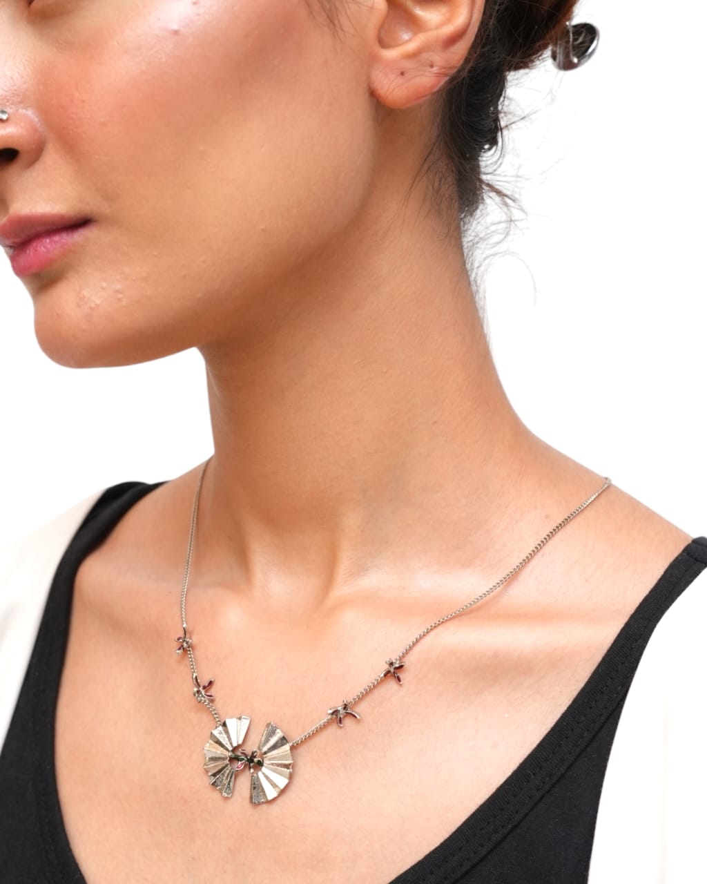 Close-up of Argento Pendant featuring floral enamel details

