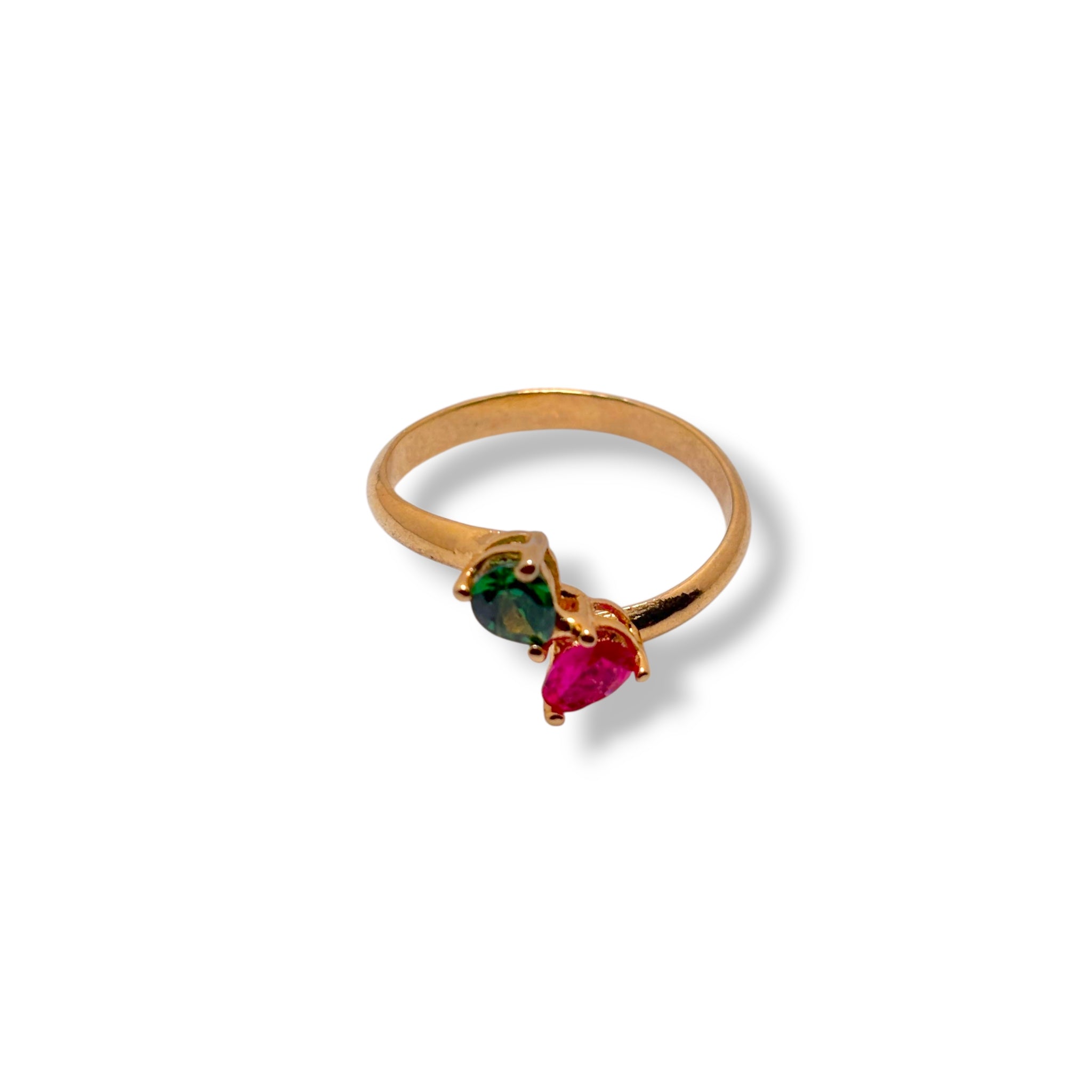 Gold ring with three gemstones on a white background